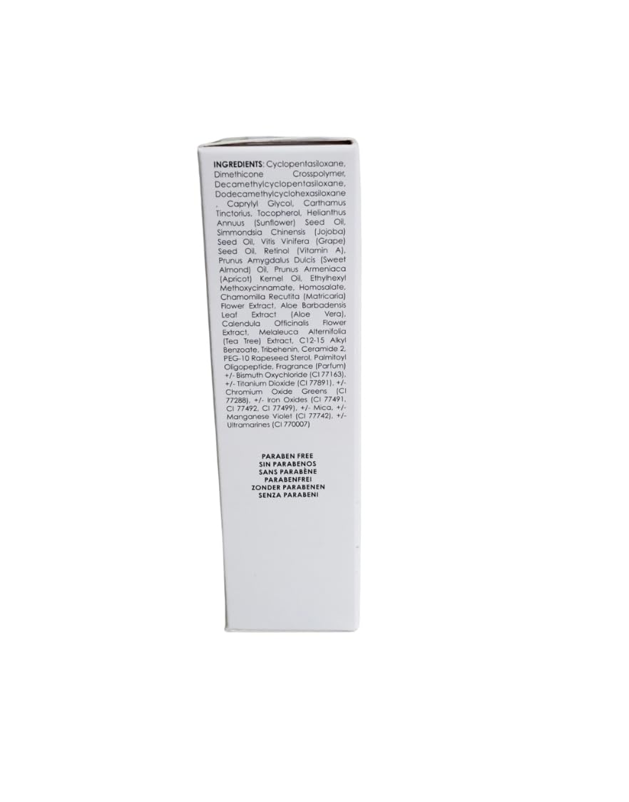 Bodyography primer bottle next to ruler showing compact 1 ounce travel-friendly size