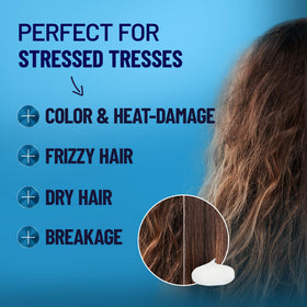 BOLD UNIQ being applied to curly hair demonstrating improved manageability