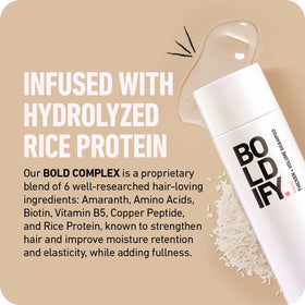 BOLDIFY shampoo in hand being applied to roots for oil removal