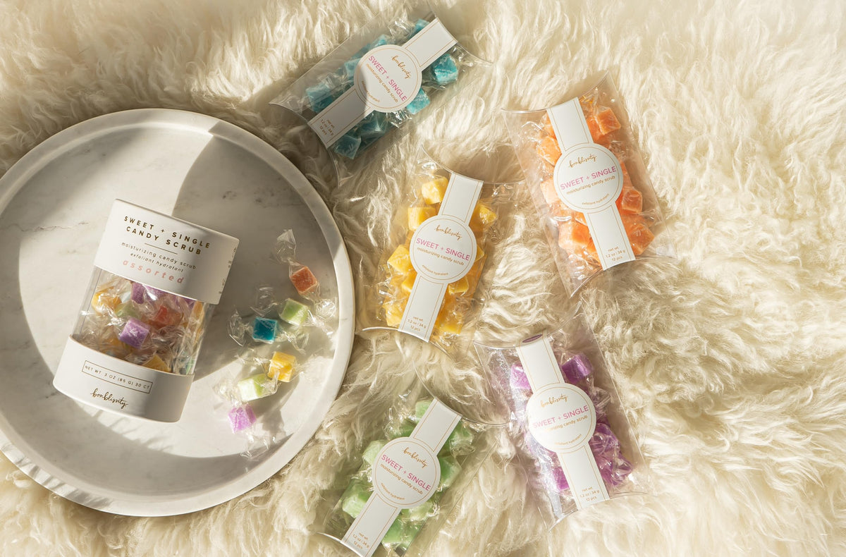 Bonblissity cube next to coin for scale highlighting compact travel-friendly single-use size