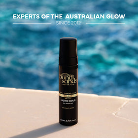 Bondi Sands bottle held in hand illustrating 200ml size and travel convenience