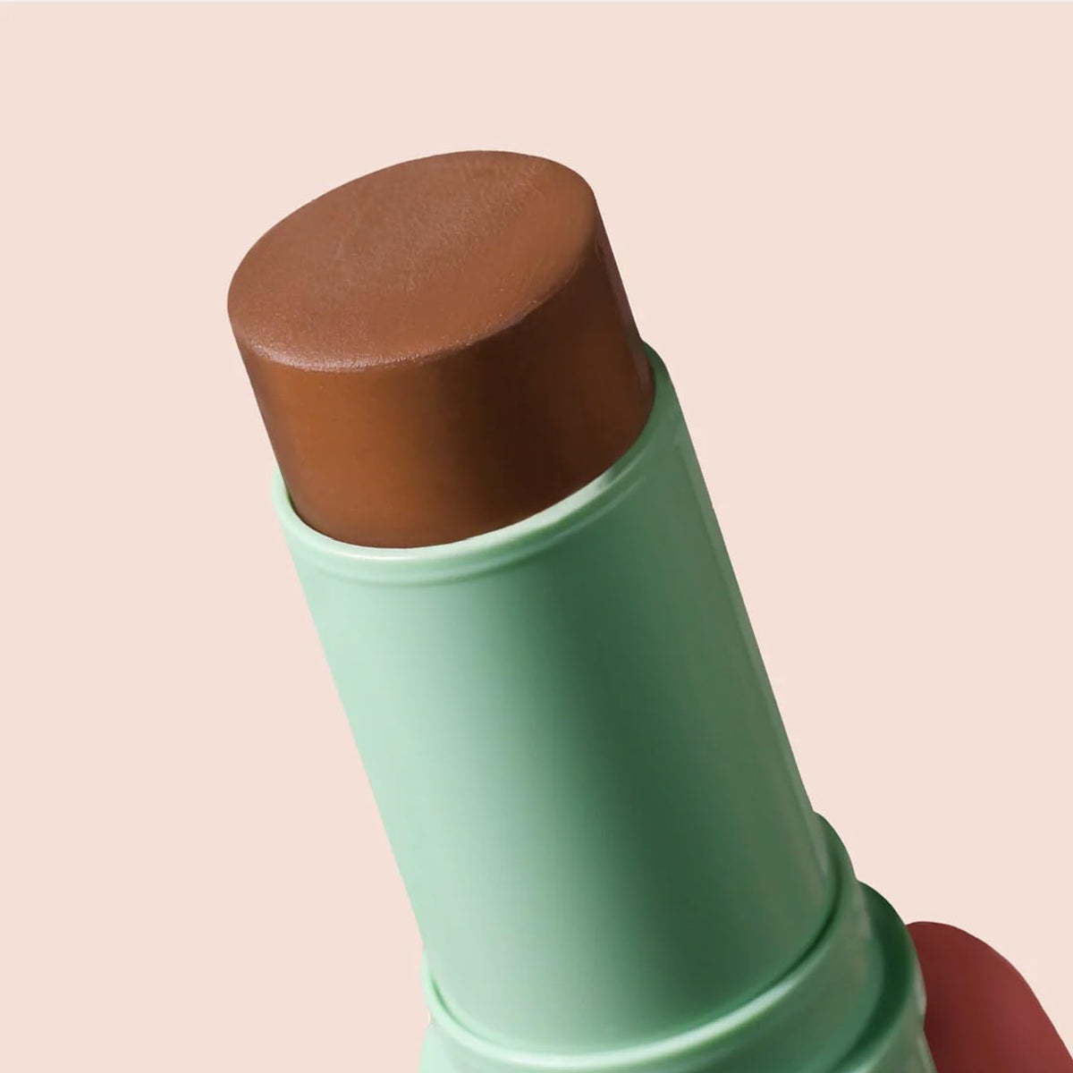 BOOM! by Cindy Joseph model applying to cheek illustrating contouring and warm definition
