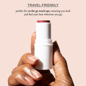 BOOM! Boomstick in a purse with other essentials showing on-the-go touch-up benefit