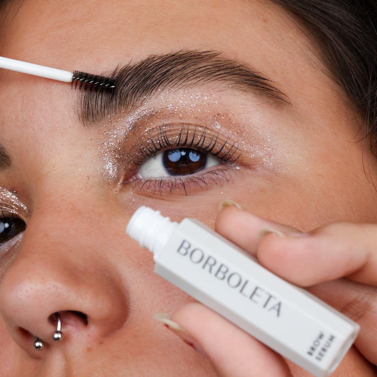 Borboleta brow serum texture drop on skin showing lightweight, non-greasy benefit