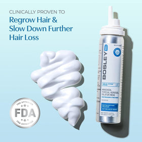 Person applying BosleyMD foam to thinning scalp to show targeted coverage