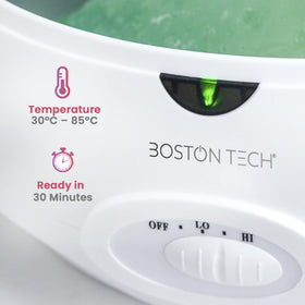 Boston Tech hand dipping into paraffin demonstrating easy at-home treatments