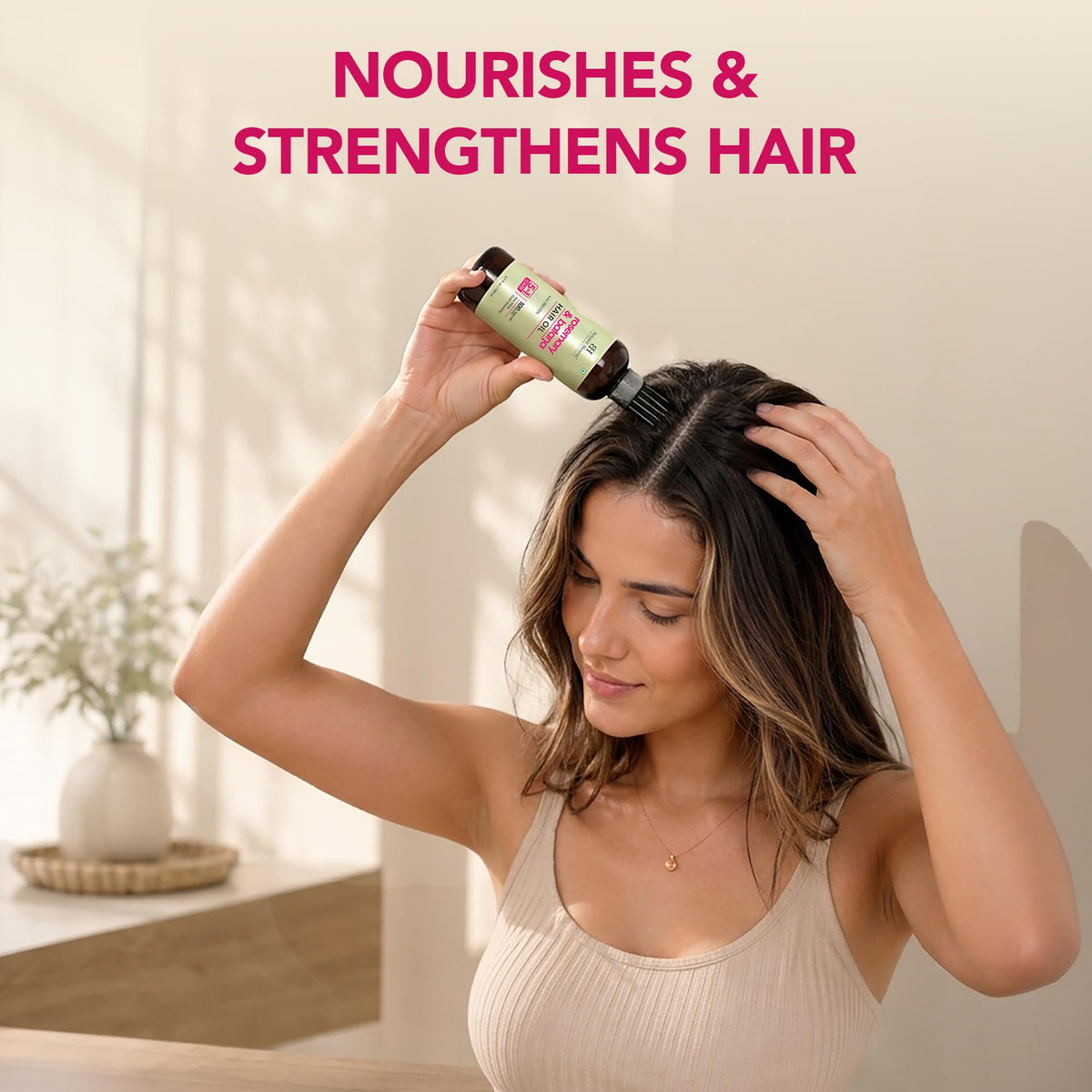 Botanic Hearth oil texture droplet on hand showing lightweight, absorbent blend for smooth hair