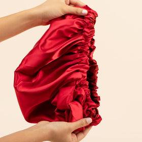 Bounce Curl bonnet care label with washing instructions to preserve satin