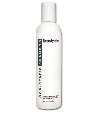 Brandywine brush in use detangling wig hair gently to reduce pulling and protect cap