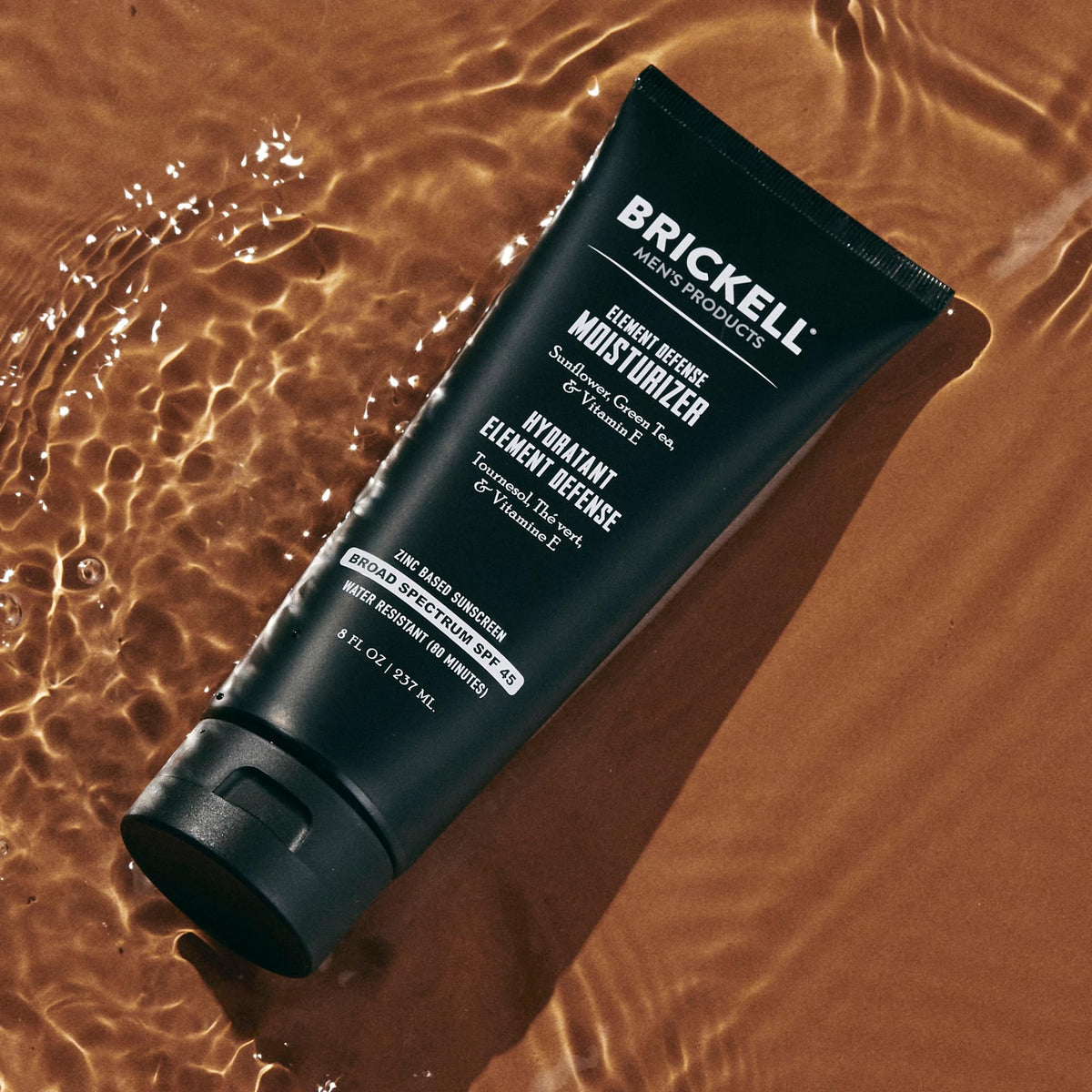 Brickell applying cream to face demonstrating easy absorption and protection