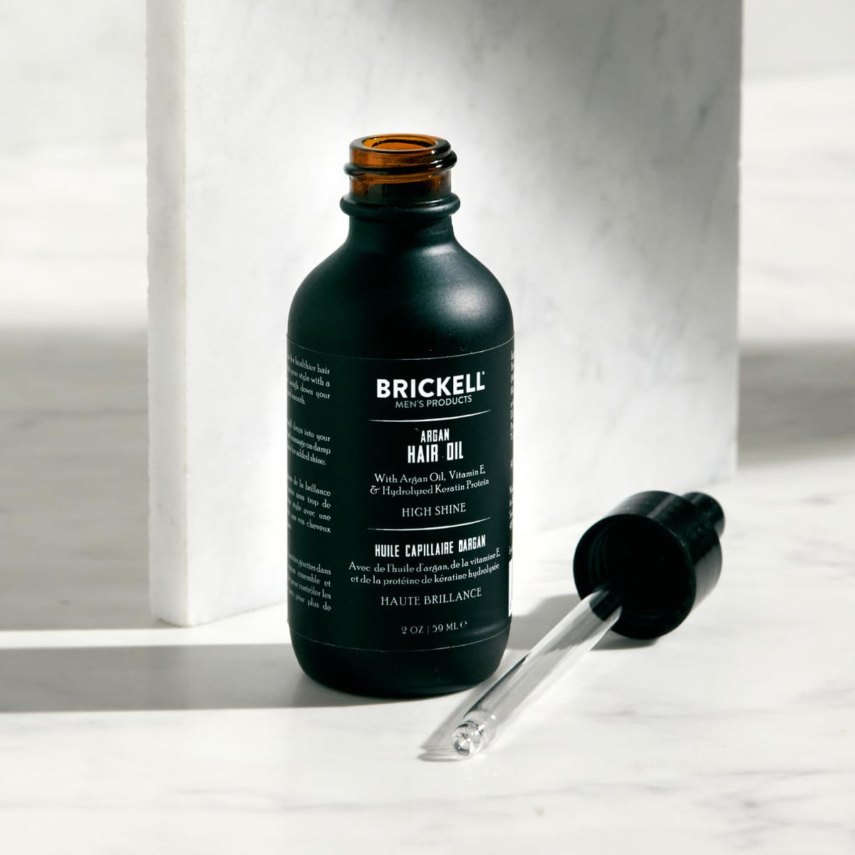 Brickell Men’s argan oil single drop texture close-up showing lightweight absorption