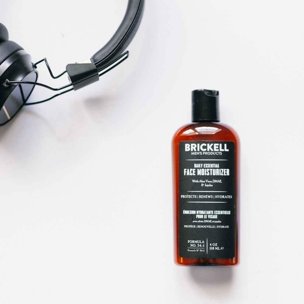 Brickell Men's Products staged in bathroom with towel and razor conveying daily routine ease
