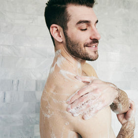 Brickell Men’s shower use image demonstrating effective deep-cleaning benefit