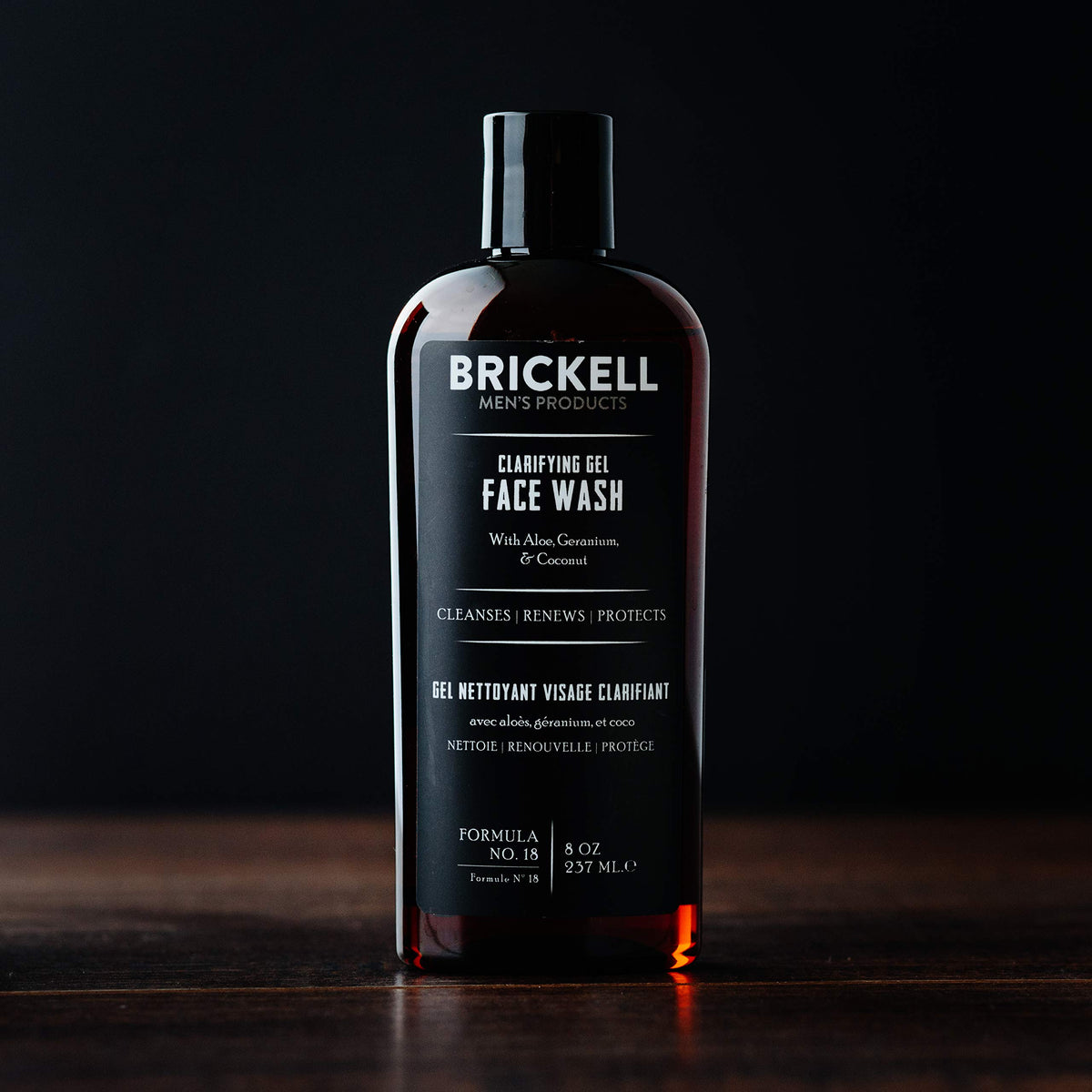 Brickell Men’s clarifying gel in hand for scale and easy dispensing benefit