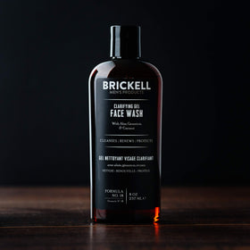 Brickell Men’s clarifying gel in hand for scale and easy dispensing benefit