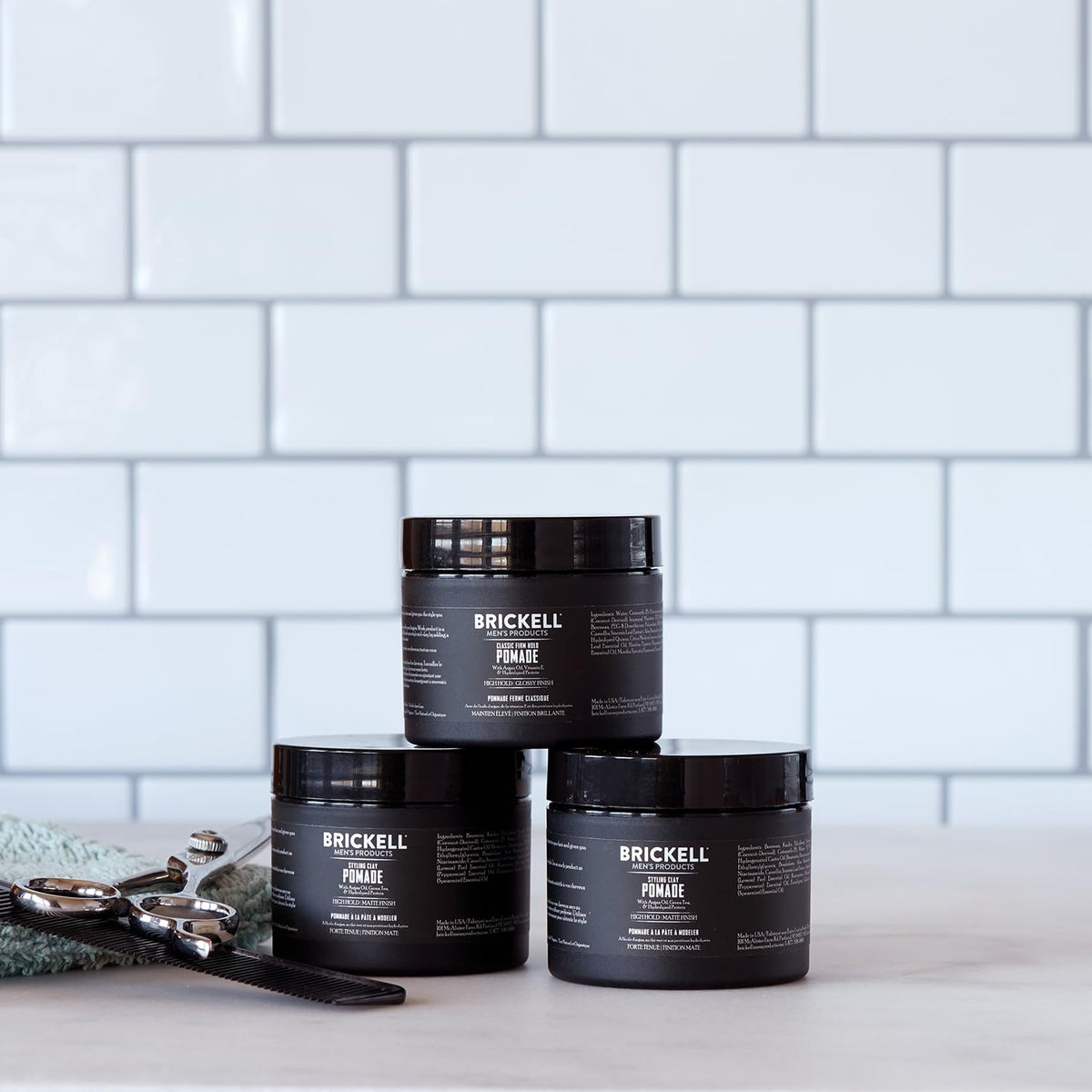 Brickell clay pomade ingredient panel with argan oil and hydrolyzed protein benefits listed