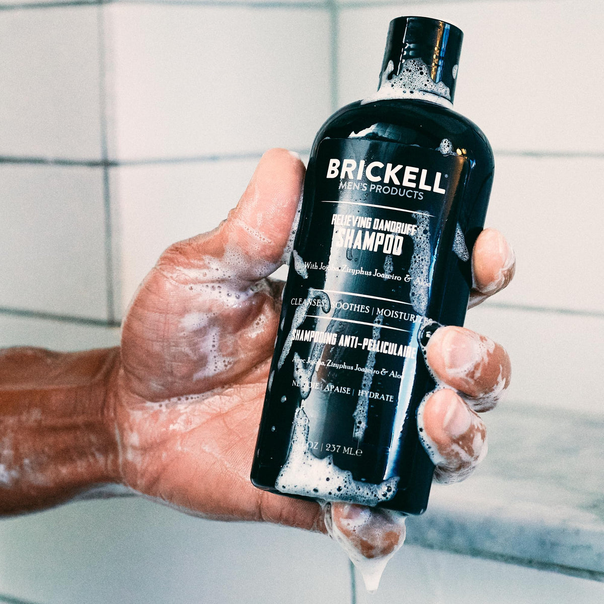 Brickell conditioner pump dispensing cream to show hydration and smoothing benefit
