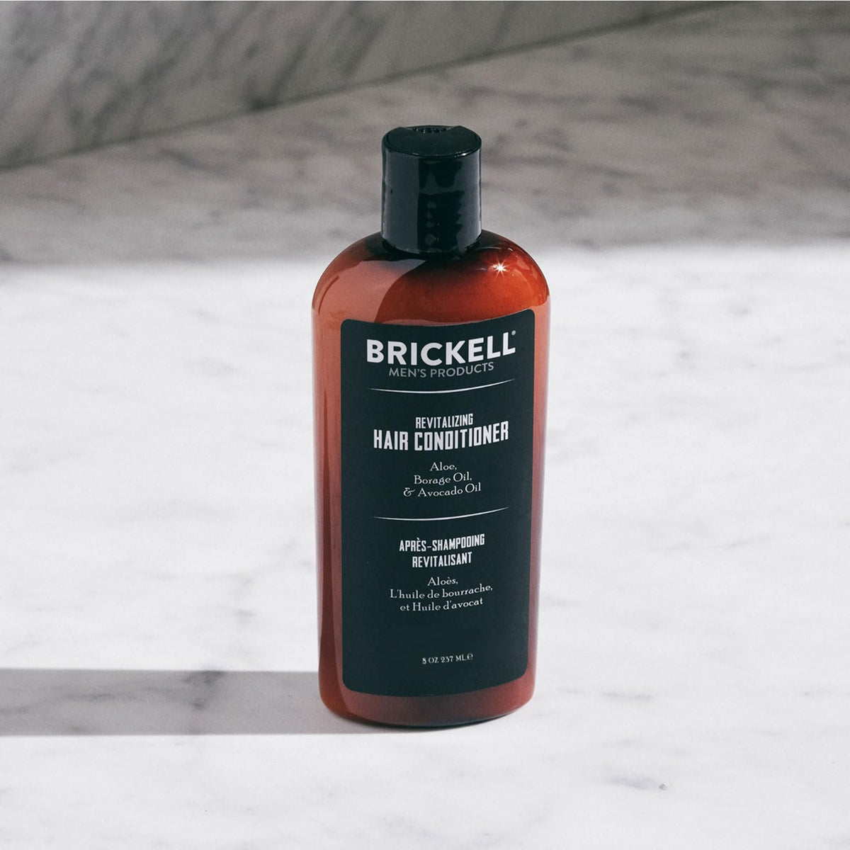 Brickell close-up of creamy conditioner texture demonstrating rich hydration