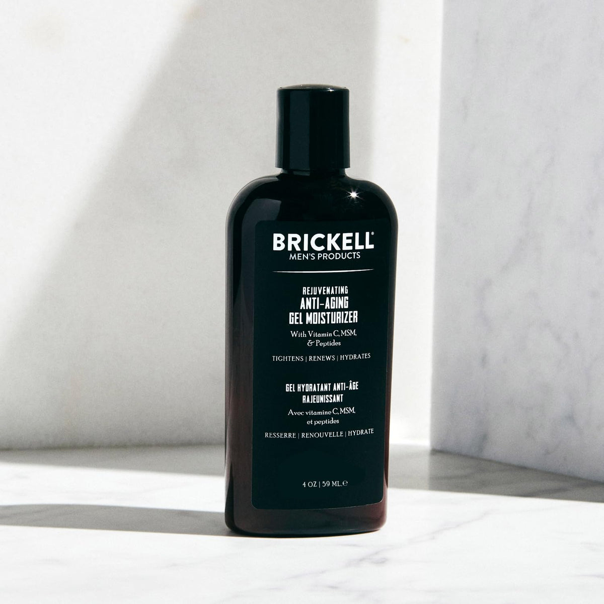 Brickell Men's product in use with man applying gel for smoother hydrated skin