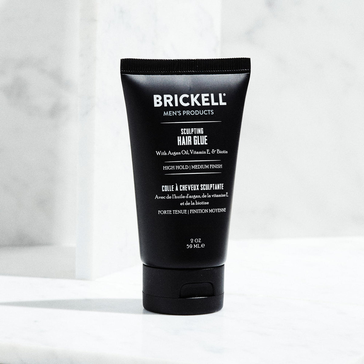 Brickell Men's Products label close-up displays ingredient list and paraben-free benefit for buyers