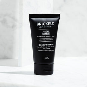 Brickell Men's Products label close-up displays ingredient list and paraben-free benefit for buyers