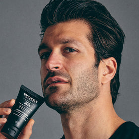 Brickell Men's Products styled lifestyle shot shows finished haircut and long-lasting hold benefit