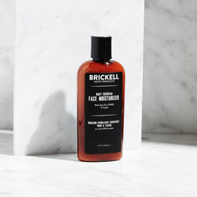 Brickell Men's Products ingredient label close-up showing niacinamide and hyaluronic acid benefits