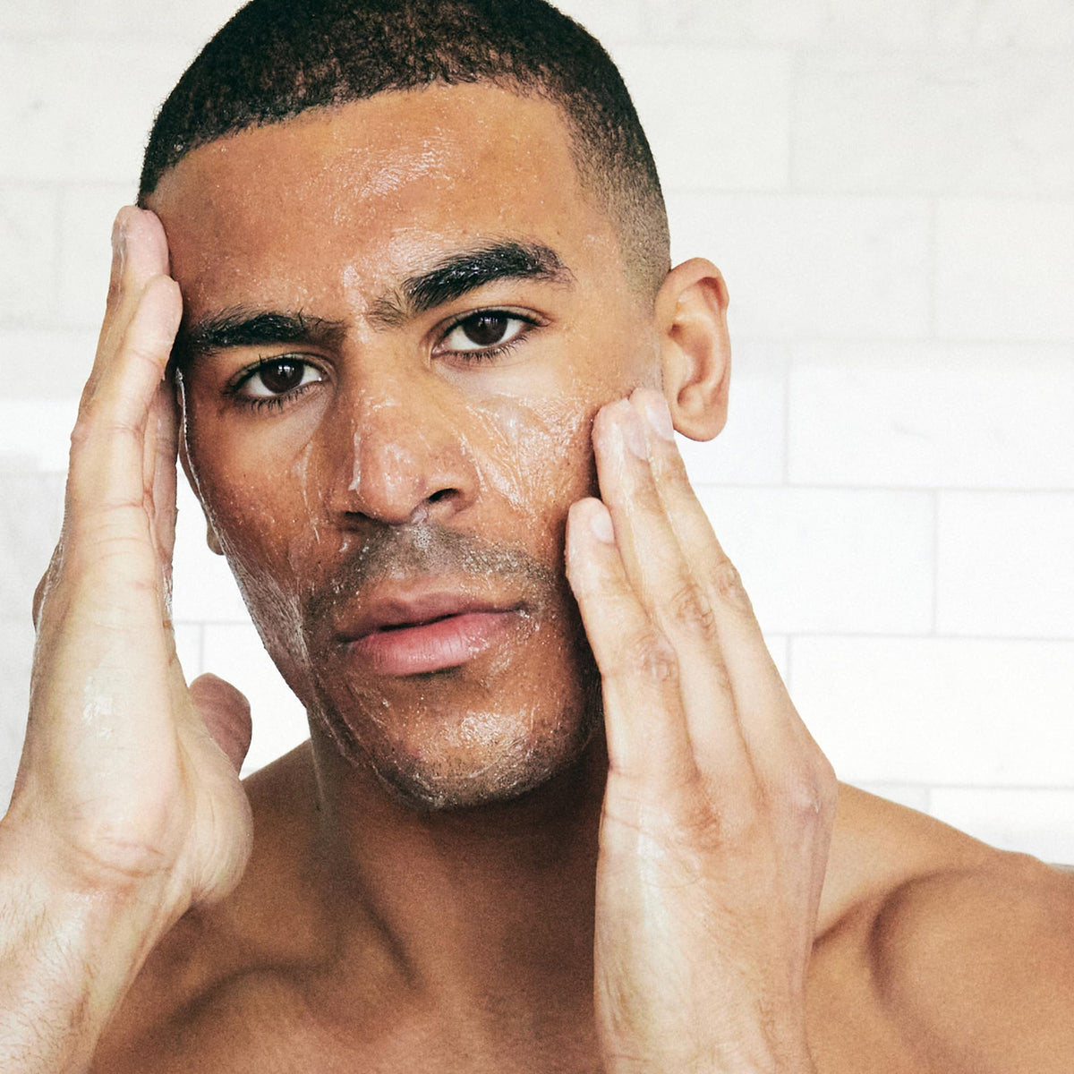 Brickell Men's Products on bathroom vanity suggesting simple daily grooming