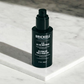Brickell Men's Products 1.7 oz tube next to everyday items showing travel size