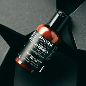 Brickell Men’s moisturizer texture on hand showing lightweight cream benefit quick absorption