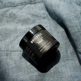 Brickell Men's Products open tin close-up revealing fiber texture and easy scoopability
