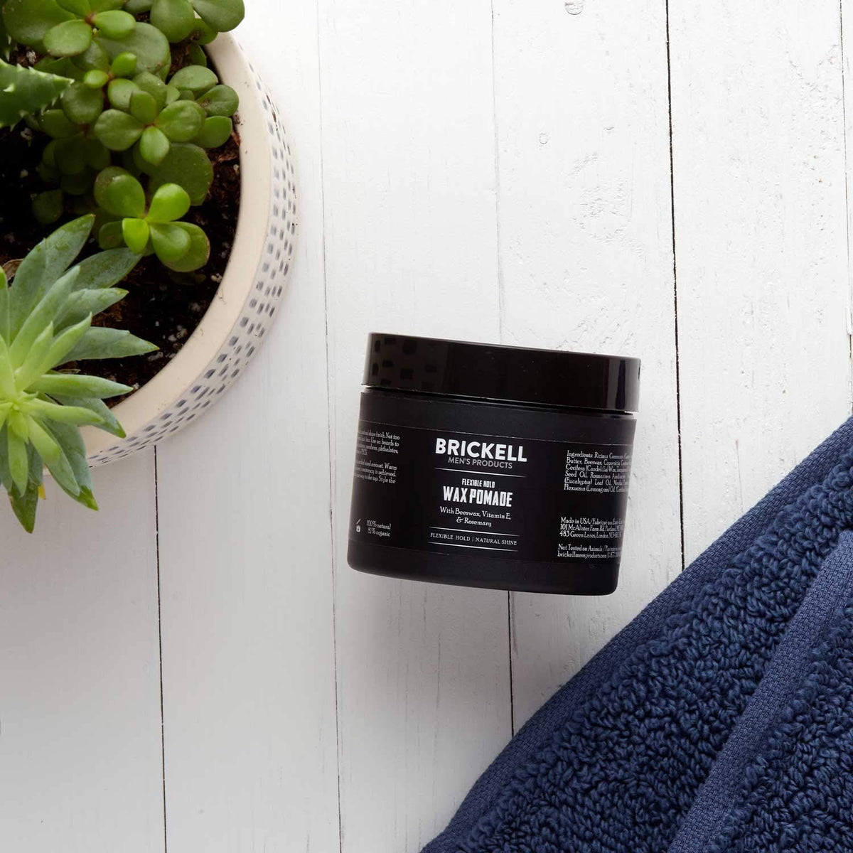 Brickell Men’s Products used on model’s hair demonstrating flexible hold and natural shine benefit