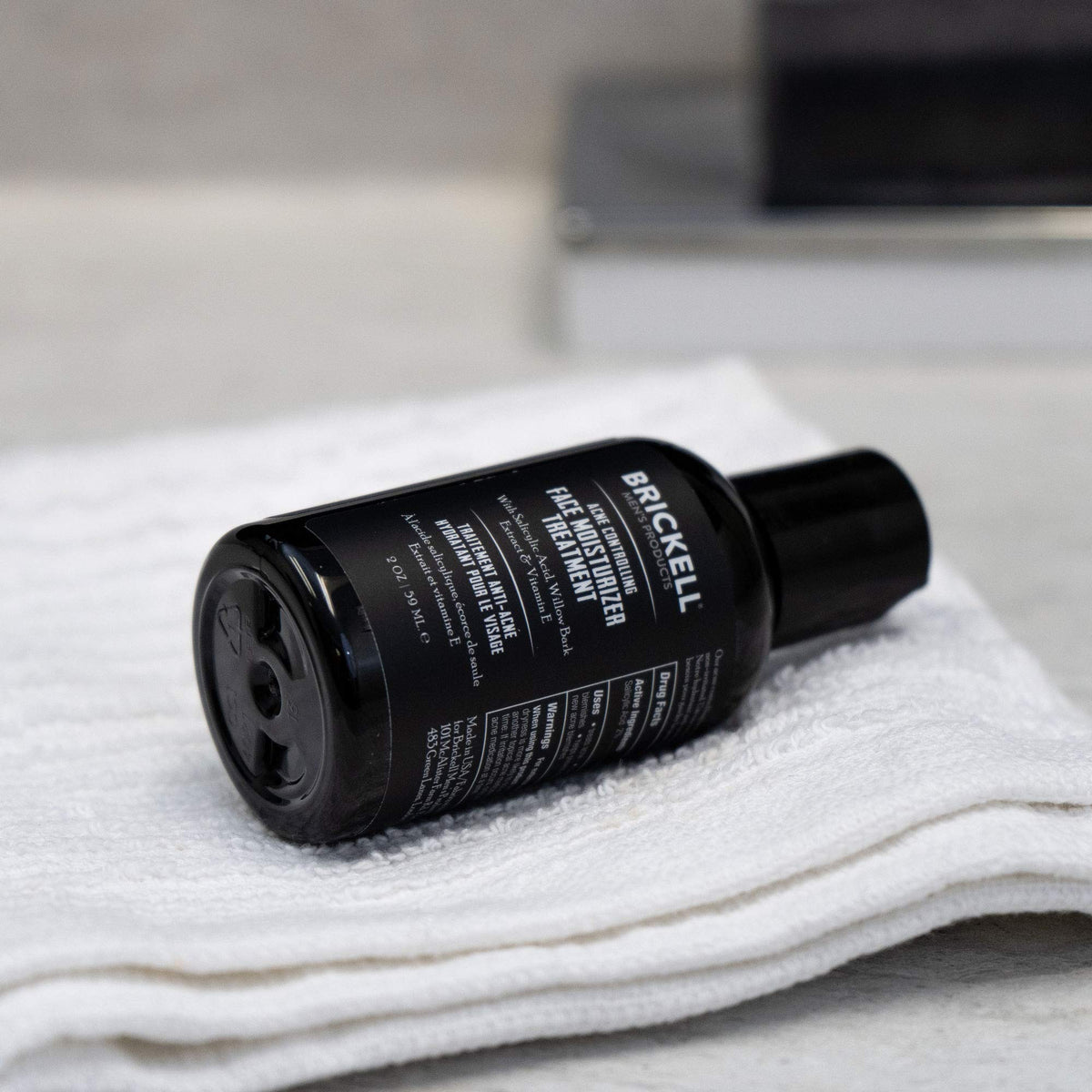 Brickell product in hand illustrating travel-ready size and easy application