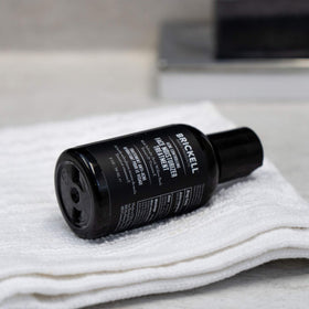 Brickell product in hand illustrating travel-ready size and easy application