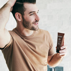 Brickell product dispensed on hand demonstrating easy lather for efficient cleansing