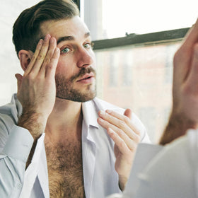 Brickell Men's Products ingredients arranged showing retinol, aloe, vitamin E benefit