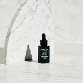 Brickell Men's Products pipette dispensing serum highlighting precise application benefit
