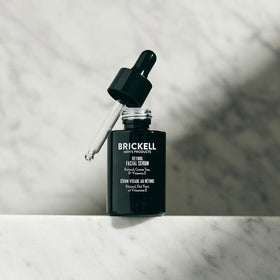Brickell Men's Products clear serum drop on skin showing lightweight hydrating benefit