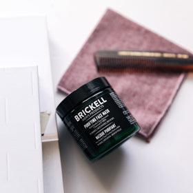 Brickell rinsing mask in bathroom showing clean, refreshed result
