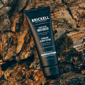 Brickell tube next to a common object showing 8 ounce size for travel