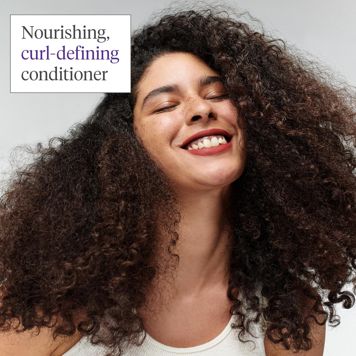 Briogeo conditioner being applied to wet hair demonstrating detangling
