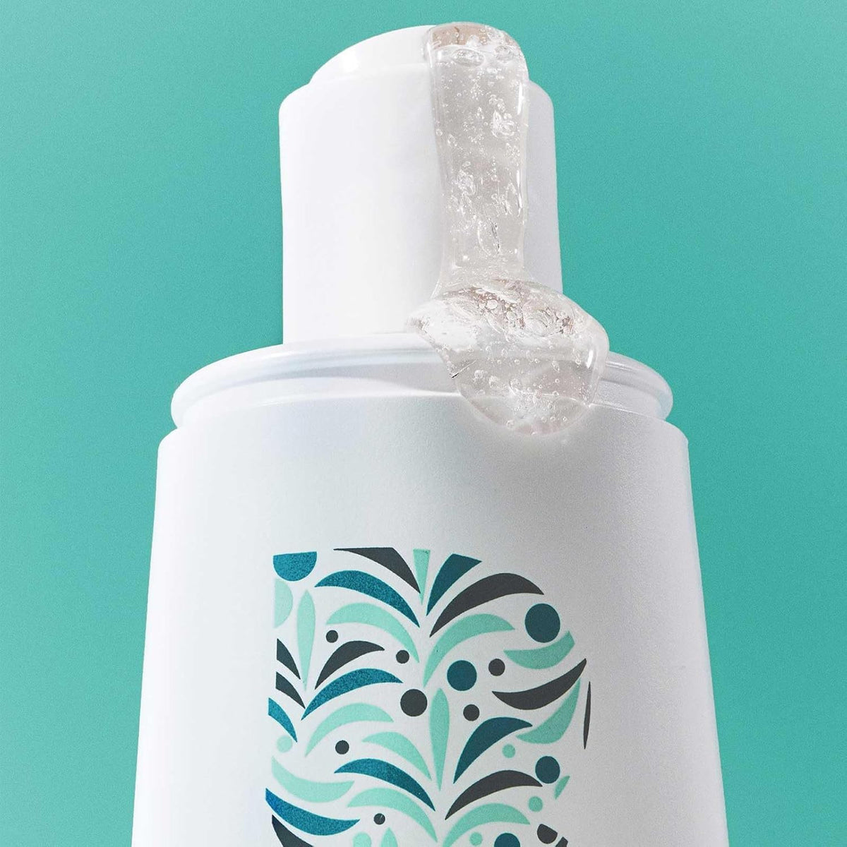 Briogeo ingredients biotin and caffeine displayed to emphasize strengthening