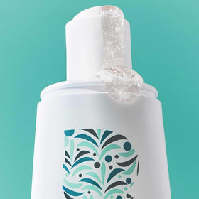 Briogeo ingredients biotin and caffeine displayed to emphasize strengthening