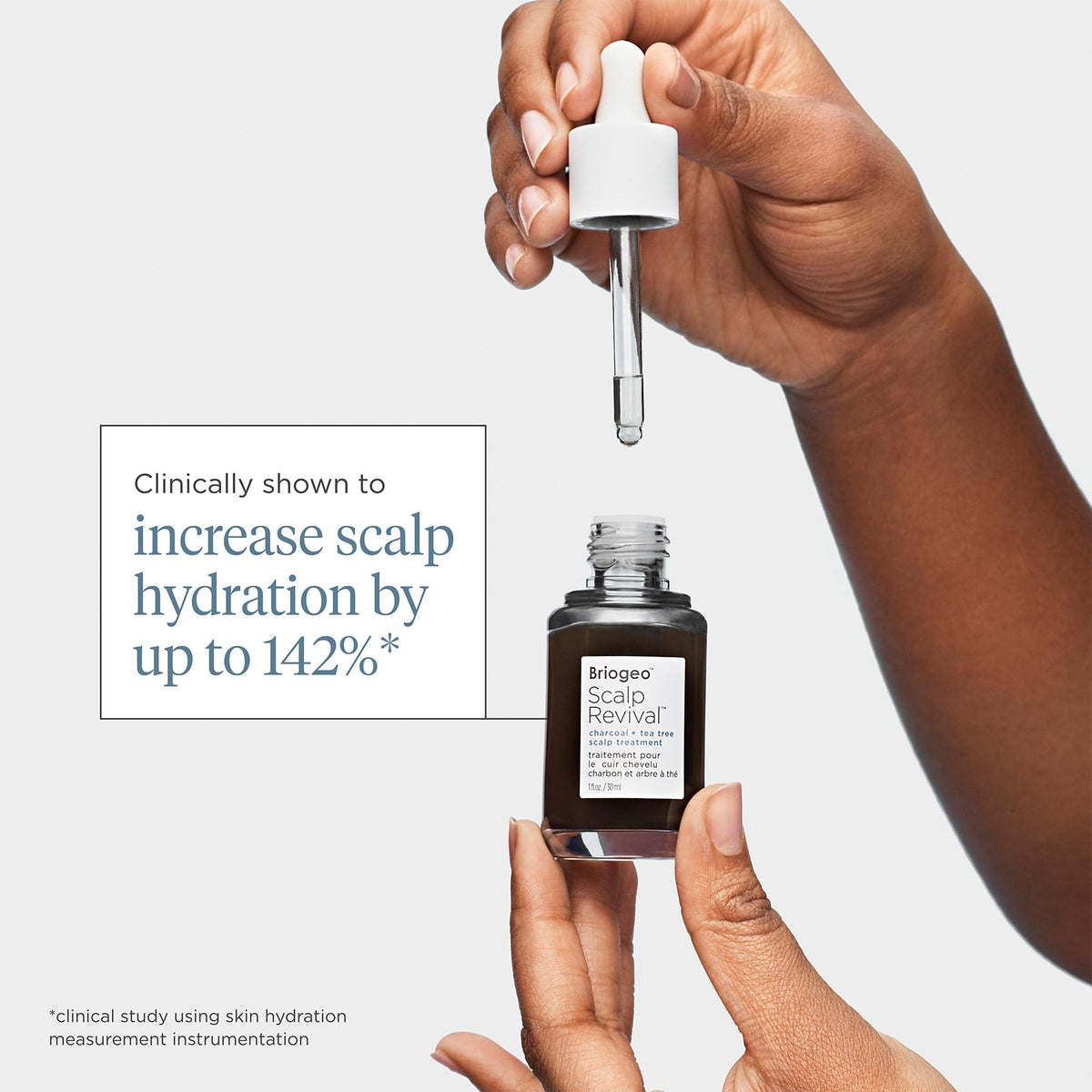 Briogeo one ounce bottle held in hand conveying compact travel-friendly size