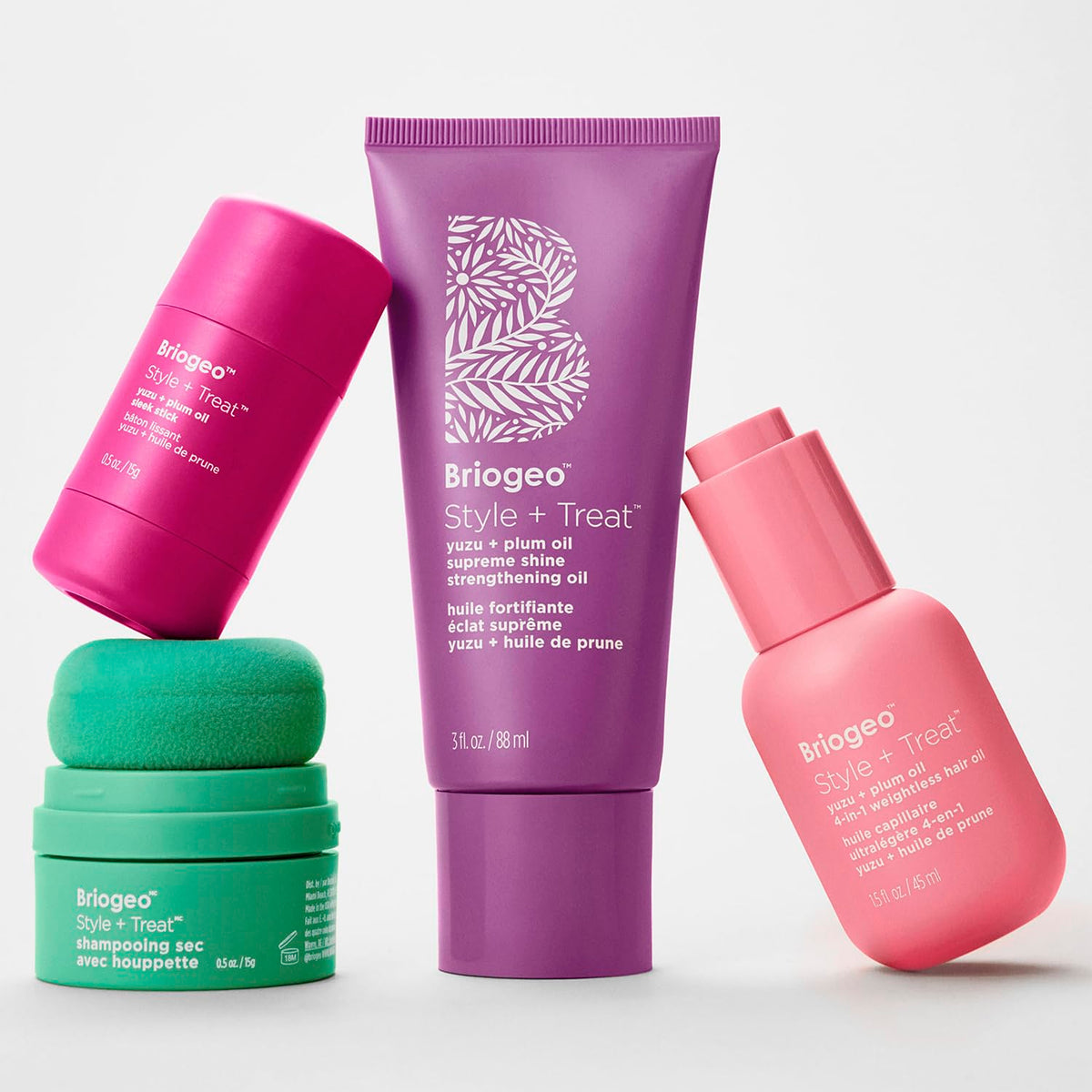 Briogeo applied to damp hair to show heat-protection preparation