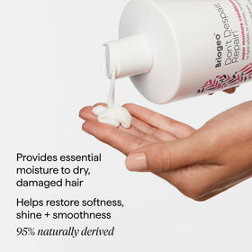 Briogeo tube beside hand to show 2 oz travel scale