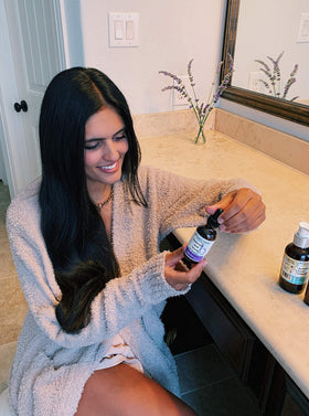 Brittanie's Thyme applying serum to face showing plumping and smoothing benefit