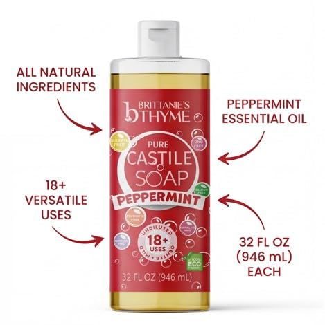 Brittanie's Thyme bottle next to fresh peppermint leaves conveying clean, natural scent