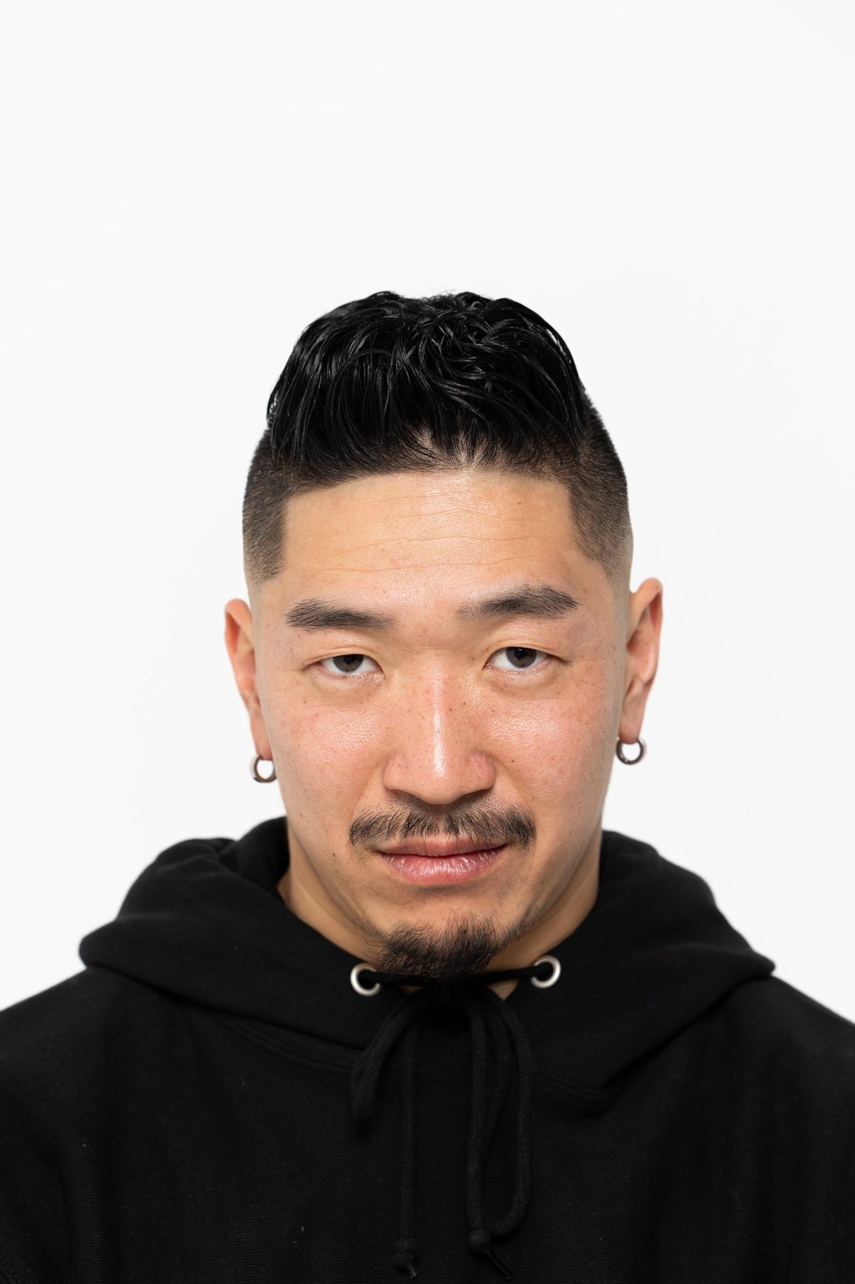 BROSH pomade in hand ready to apply for easy styling benefit