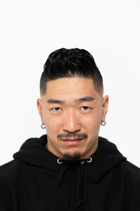 BROSH pomade in hand ready to apply for easy styling benefit